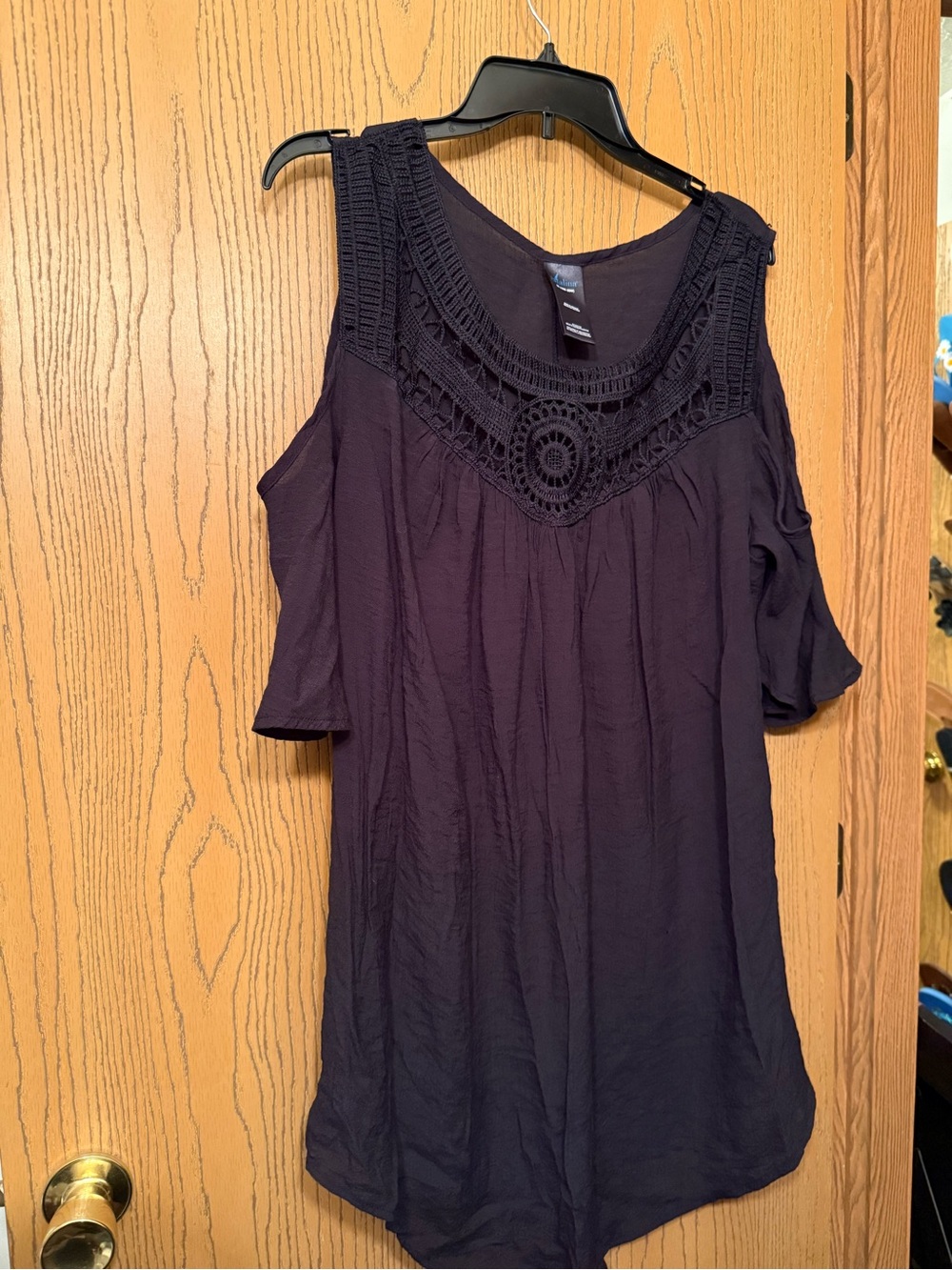 Catalina size 2X (18W-20W). Black short sleeved top